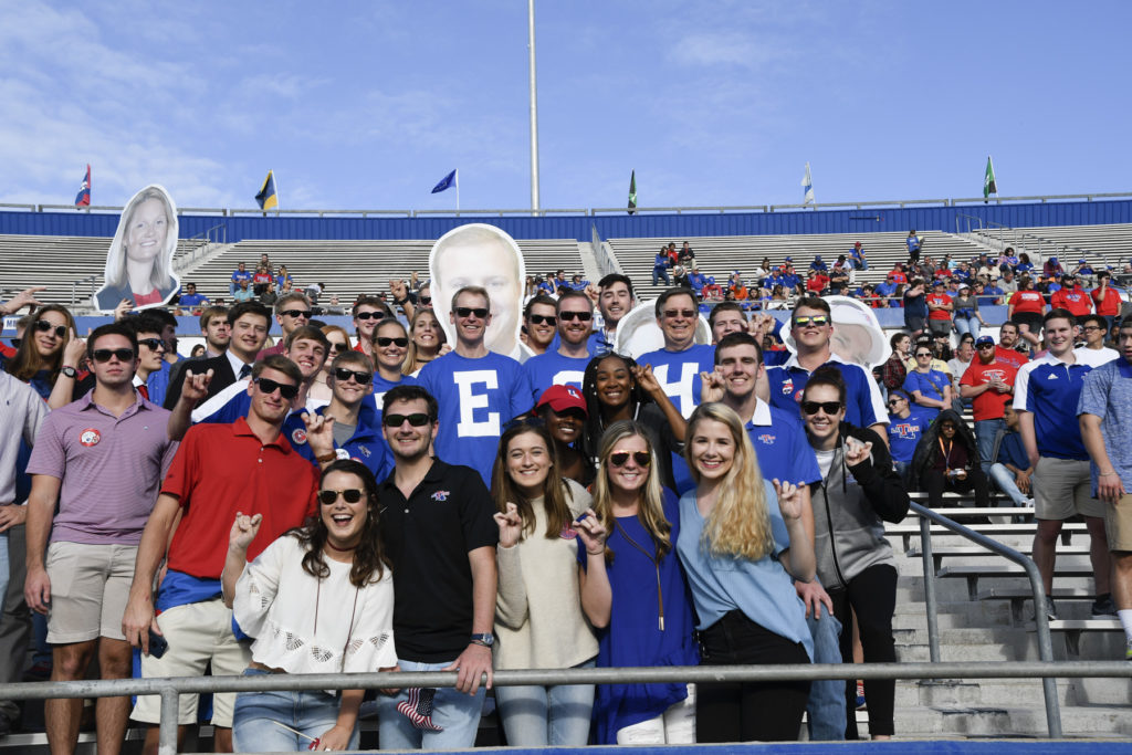 Dr. Les Guice enjoys a Louisiana Tech football game with students.