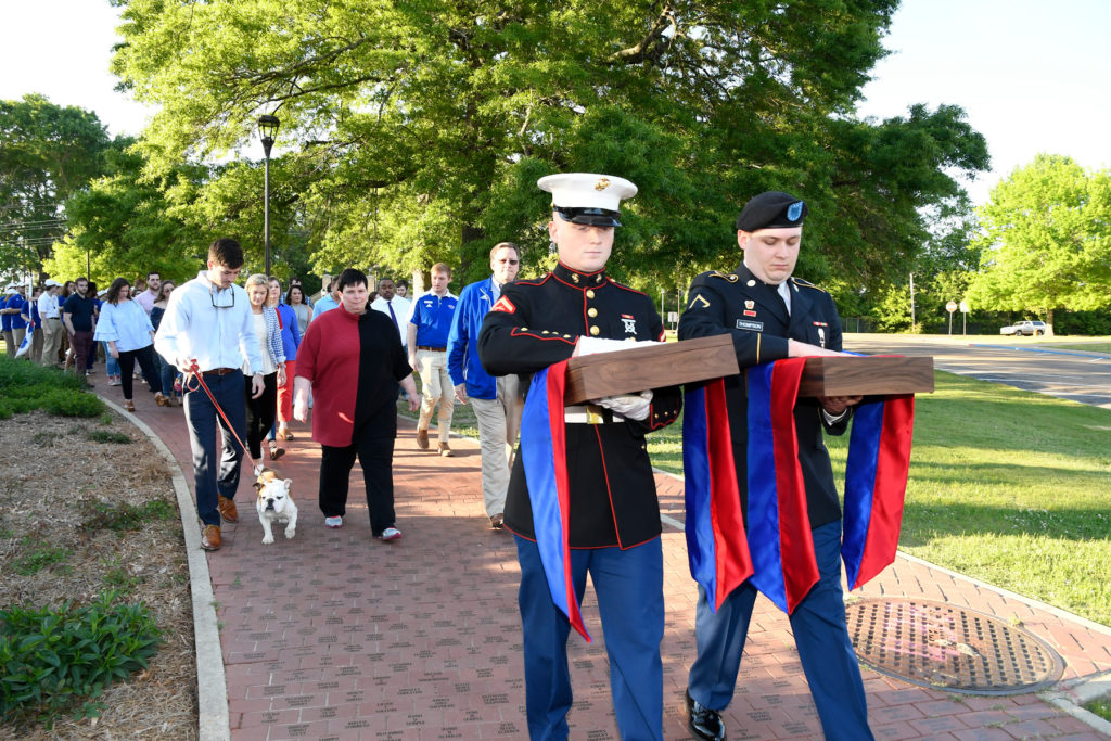 Rings are escorted to the clock tower to be guarded overnight.