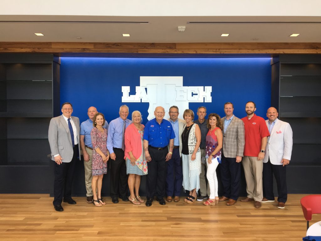 Leo Sanford poses for a photo with his family and Louisiana Tech administrators.