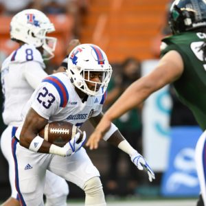 Jaqwis Dancy running the football against Hawaii.