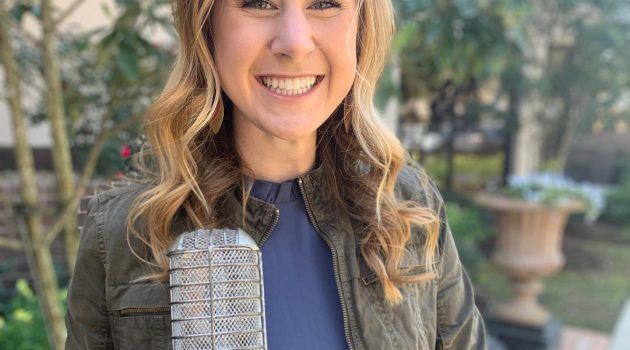 Madison Kaufman holding her 2019 Student Broadcaster of the Year Award.