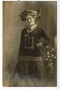 A woman wearing a Louisiana Industrial Institute sweater.