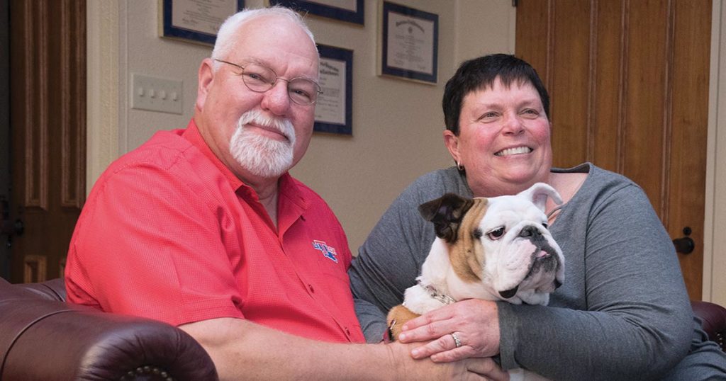 Cathi Cox-Boniol and her husband Tom with Tech XXII.