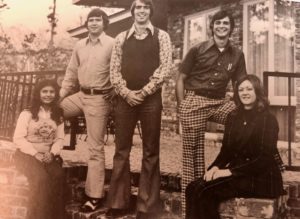 Five students on the steps of the president's home.