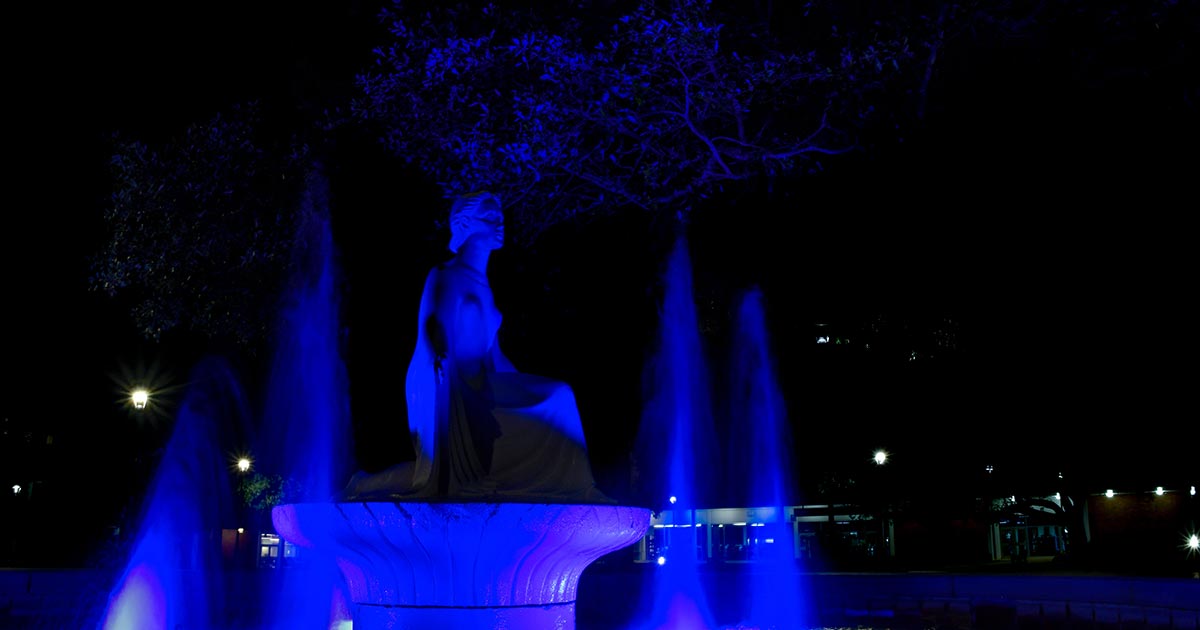 The Lady of the Mist lit in blue.