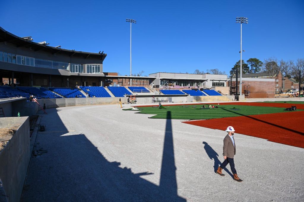 Adam McGuirt surveying the new baseball turf.