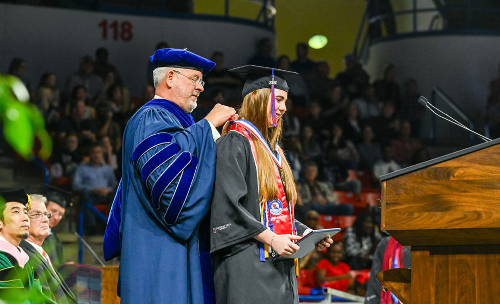 Grace Beard, GPA intern turned employee, and Dr. Henderson at graduation.
