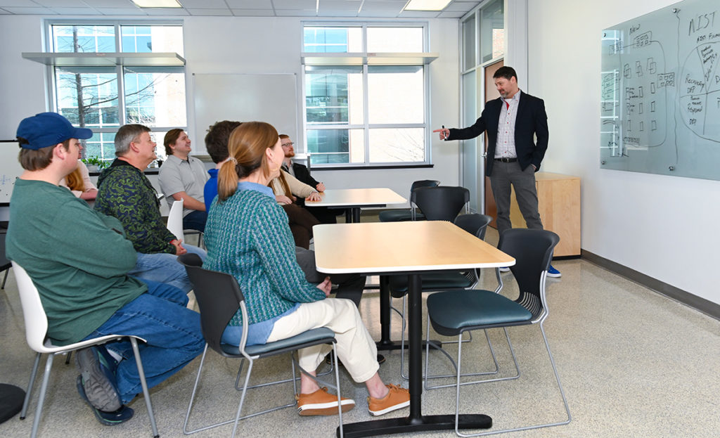 GPA COO De Robertson speaks during a staff meeting at Tech Pointe I.