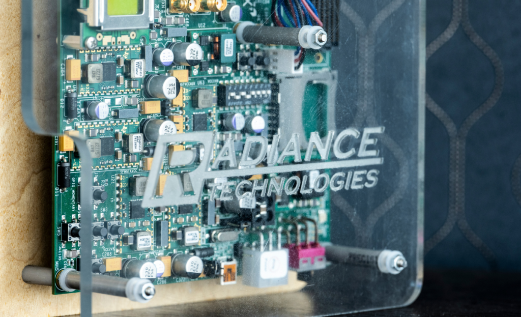 The Radiance Technologies logo in front of a microchip