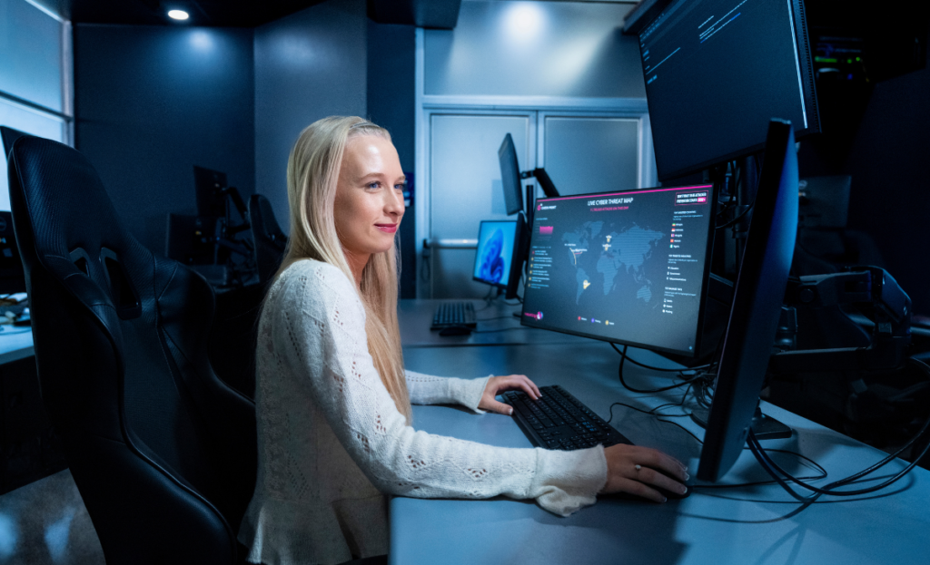 Tess Gardner working in the on-campus Security Operations Center