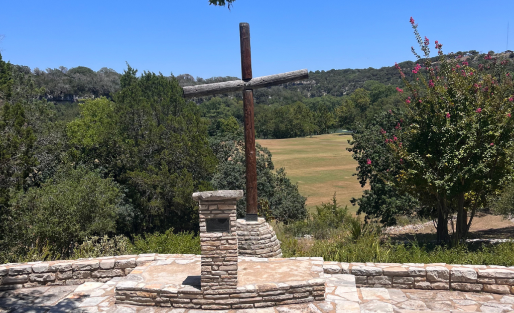 A cross stands tall at Camp Mystic's Chapel Hill.
