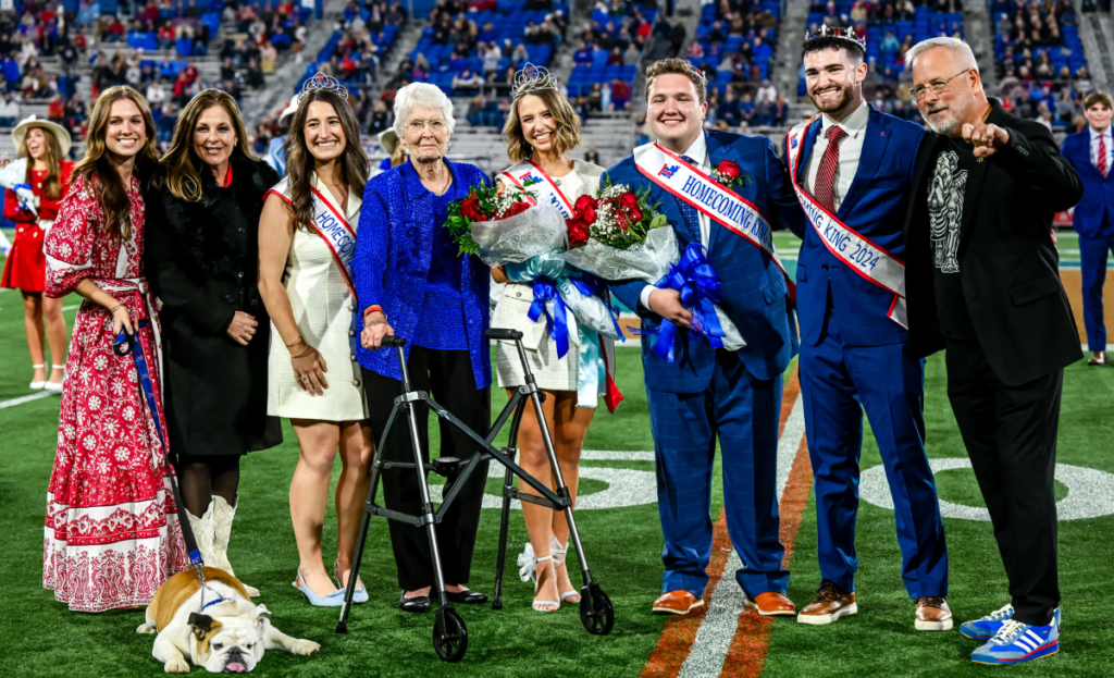 Annie Heard and Miriam Pipes Savage, with Homecoming King, former Homecoming King and Queen, President Jim Henderson, Tonia Henderson, and Techie.