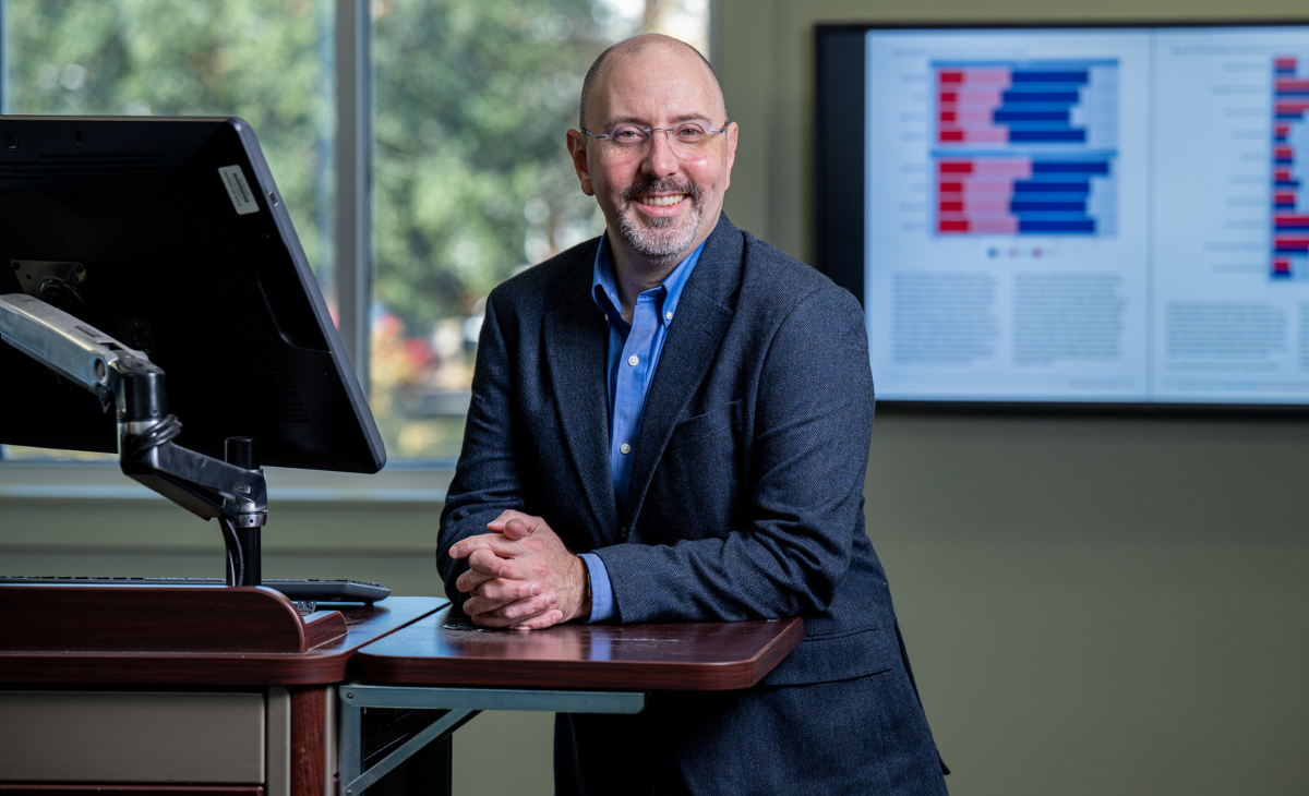 Patrick Scott posing for a photo at the College of Business